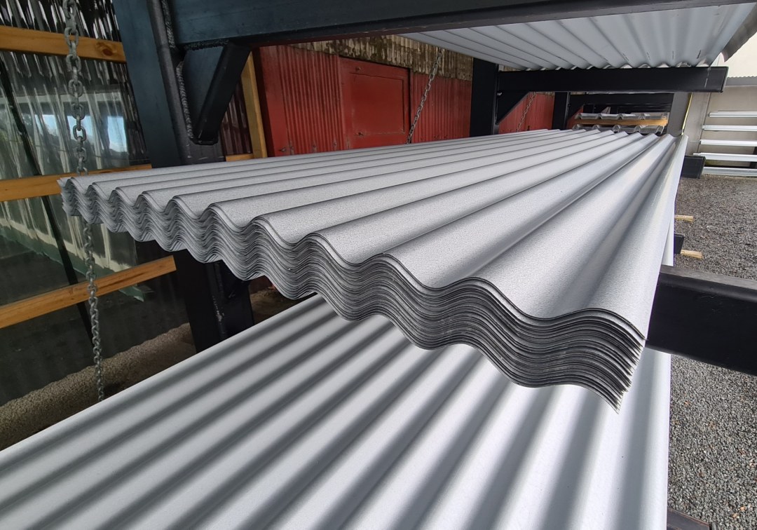 Corrugated roof sheets on a rack at a retailer